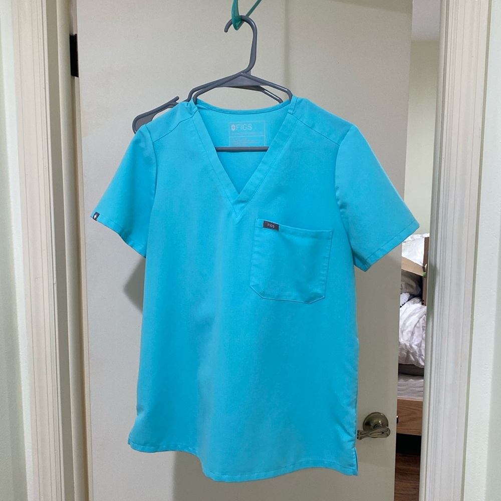 Figs light blue scrubs. Top- size: S, bottoms size: S/P